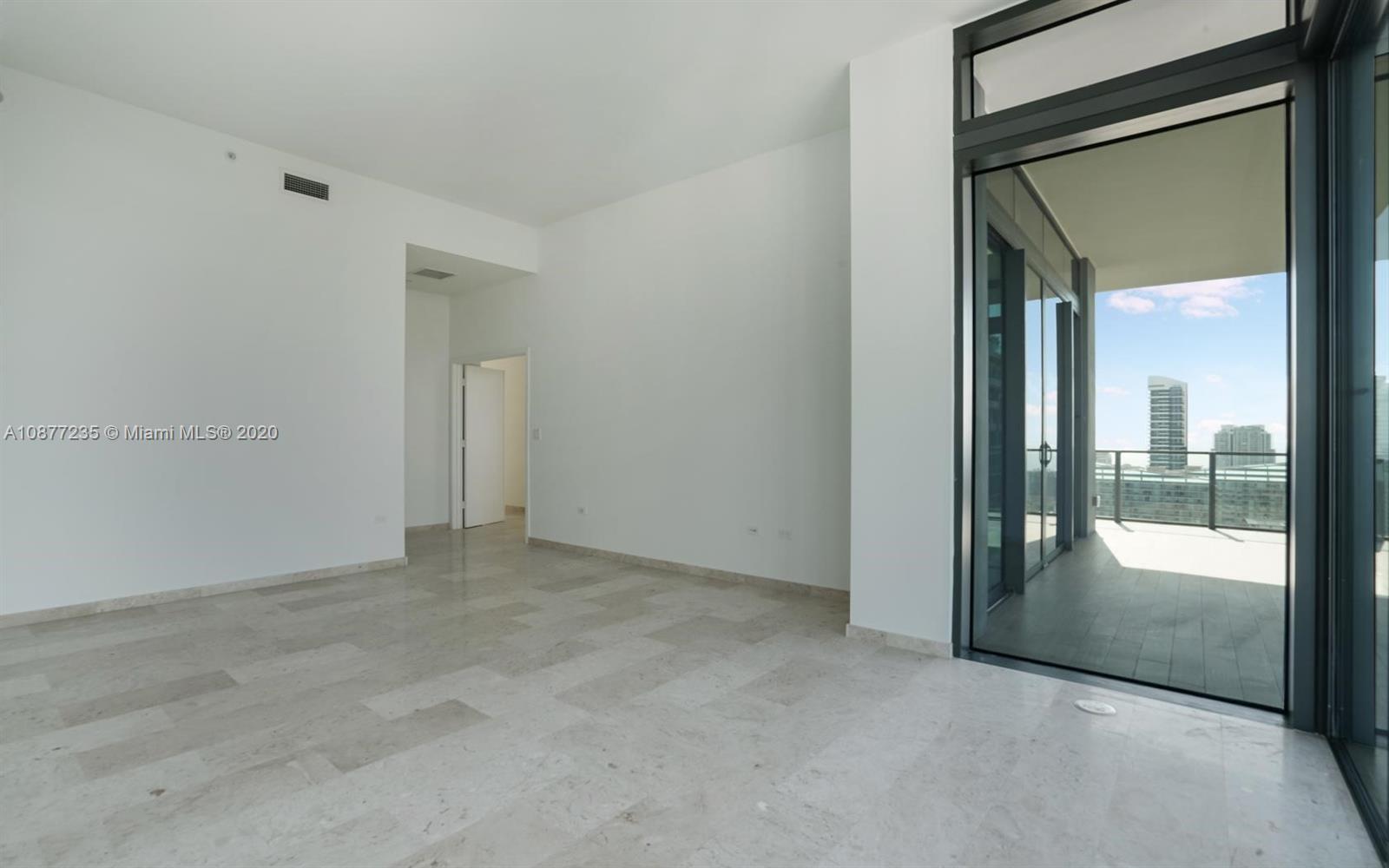 88 Southwest 7th Street, Unit 4001 Miami, FL 33130 - Photo 21 of 21 an empty room with glass door and a floor to ceiling window
