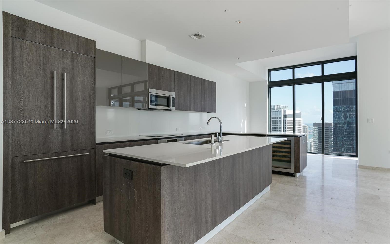 88 Southwest 7th Street, Unit 4001 Miami, FL 33130 - Photo 4 of 21 a kitchen with stainless steel appliances granite countertop a refrigerator and a sink
