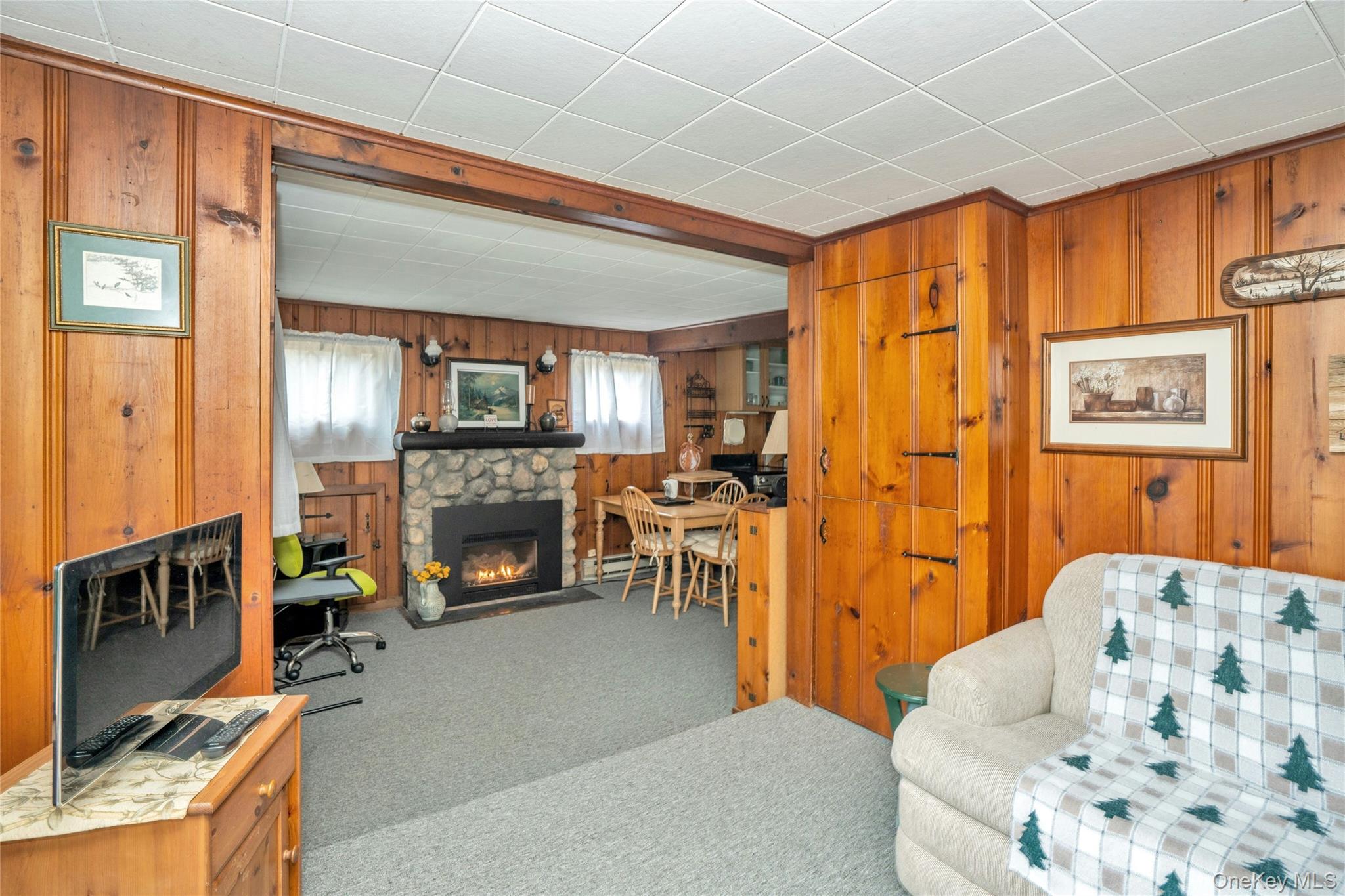 16 Nymph Road Rocky Point, NY 11778 - Photo 6 of 14 Livingroom leading to stone fireplace.