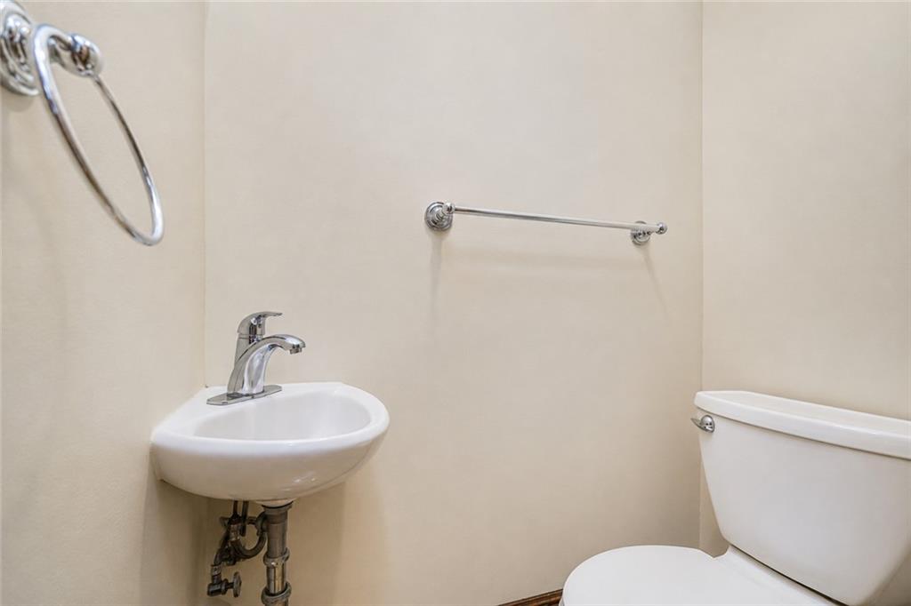 1352 Bay Ridge Parkway Brooklyn, NY 11228 - Photo 16 of 42 a bathroom with a sink a mirror and a toilet