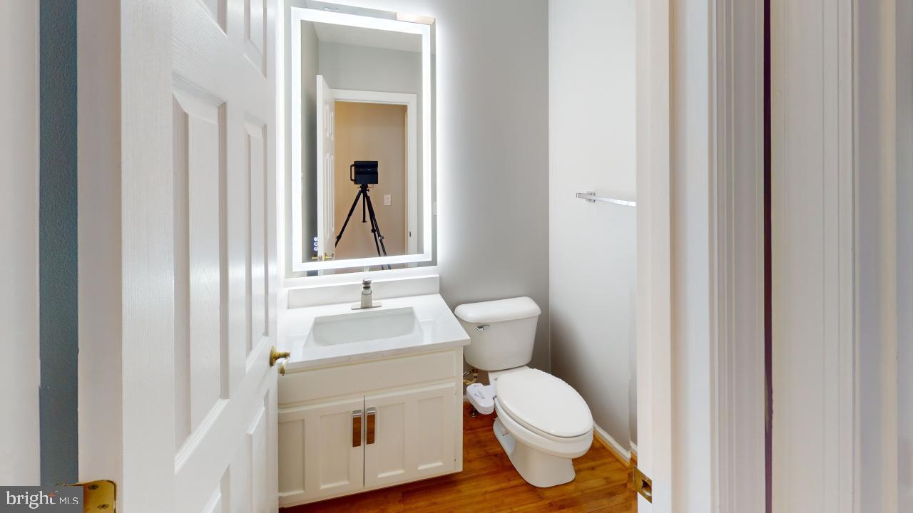 202 Lakeside Loop Ridgeley, WV 26753 - Photo 15 of 45 a bathroom with a toilet sink and mirror