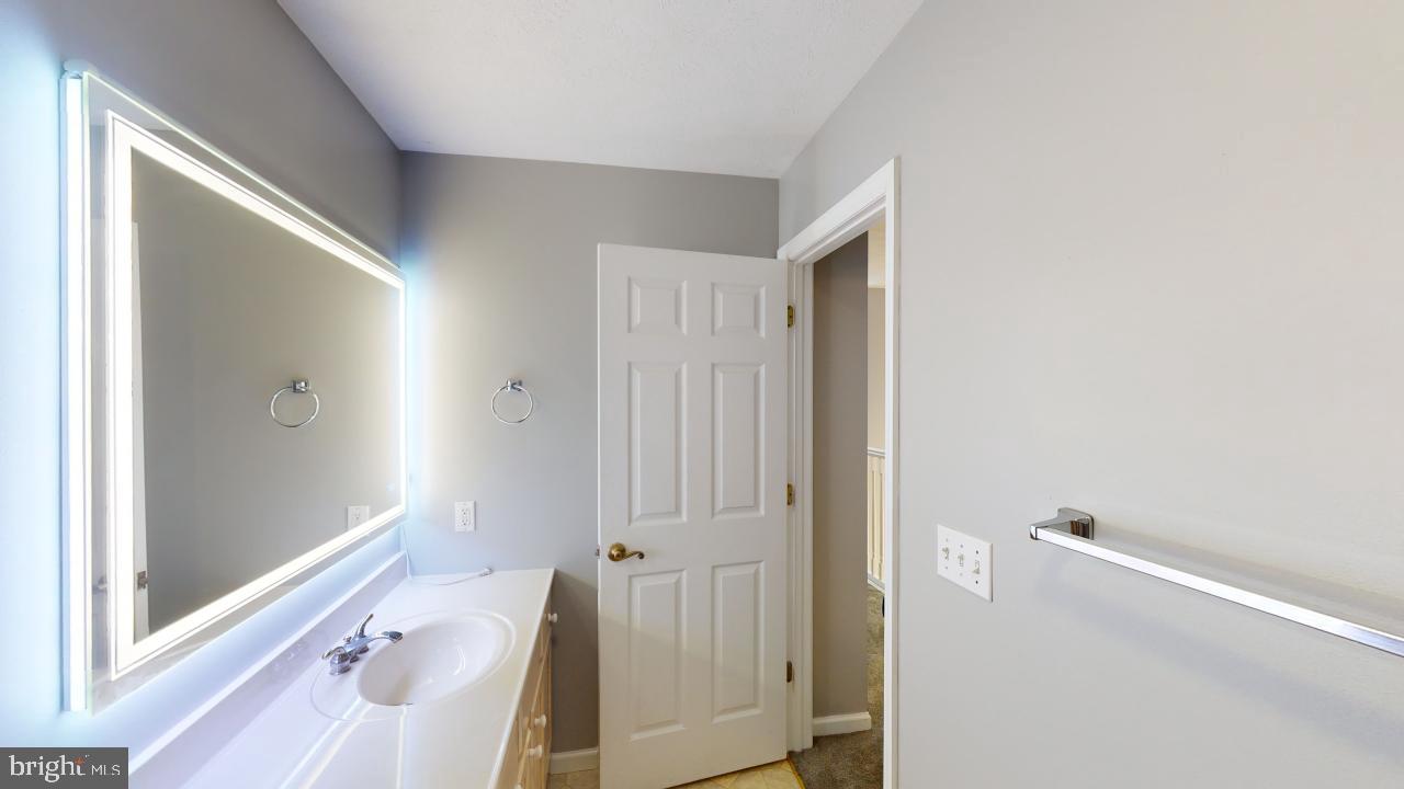 202 Lakeside Loop Ridgeley, WV 26753 - Photo 25 of 45 a bathroom with a tub shower and sink