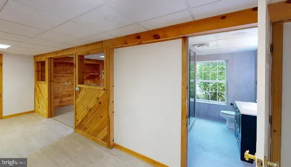 a view of a room with furniture and front door