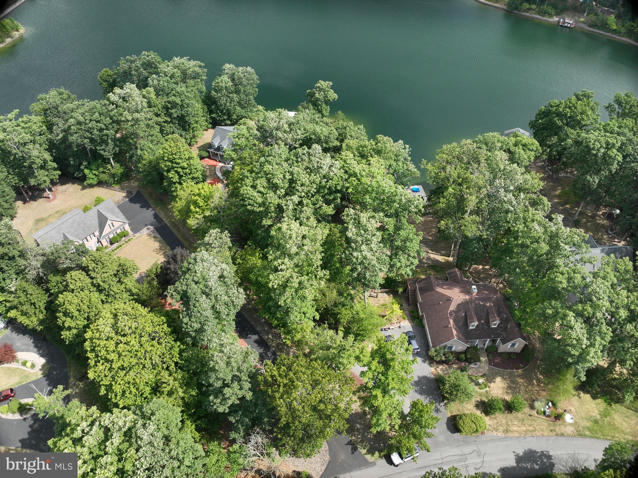202 Lakeside Loop Ridgeley, WV 26753 - Photo 43 of 45 an aerial view of a house with a yard and lake view
