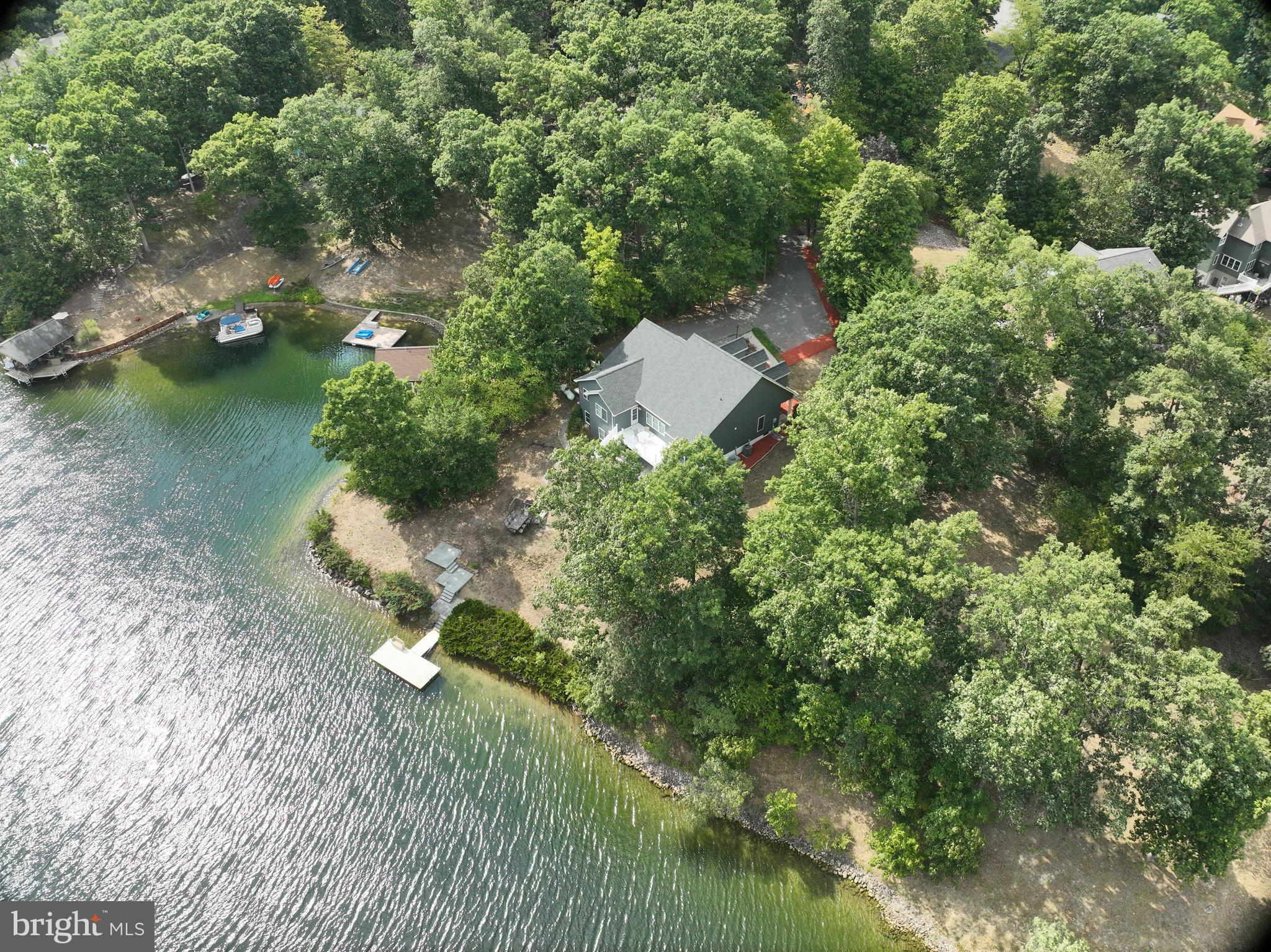 202 Lakeside Loop Ridgeley, WV 26753 - Photo 45 of 45 an aerial view of a house with a yard basket ball court and outdoor seating
