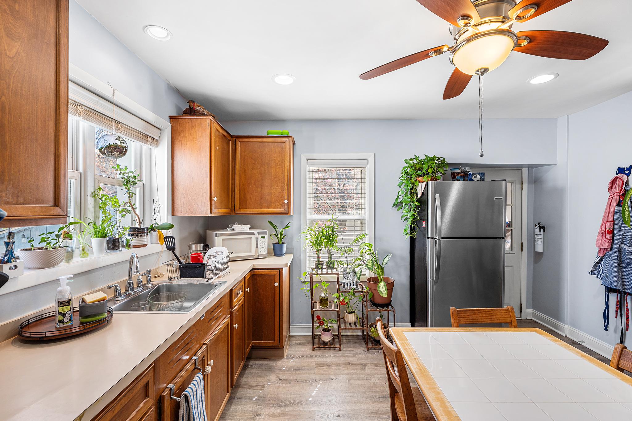 16 Volusia Avenue Hamilton, NJ 08610 - Photo 11 of 50 a kitchen that has a lot of cabinets a sink and a refrigerator