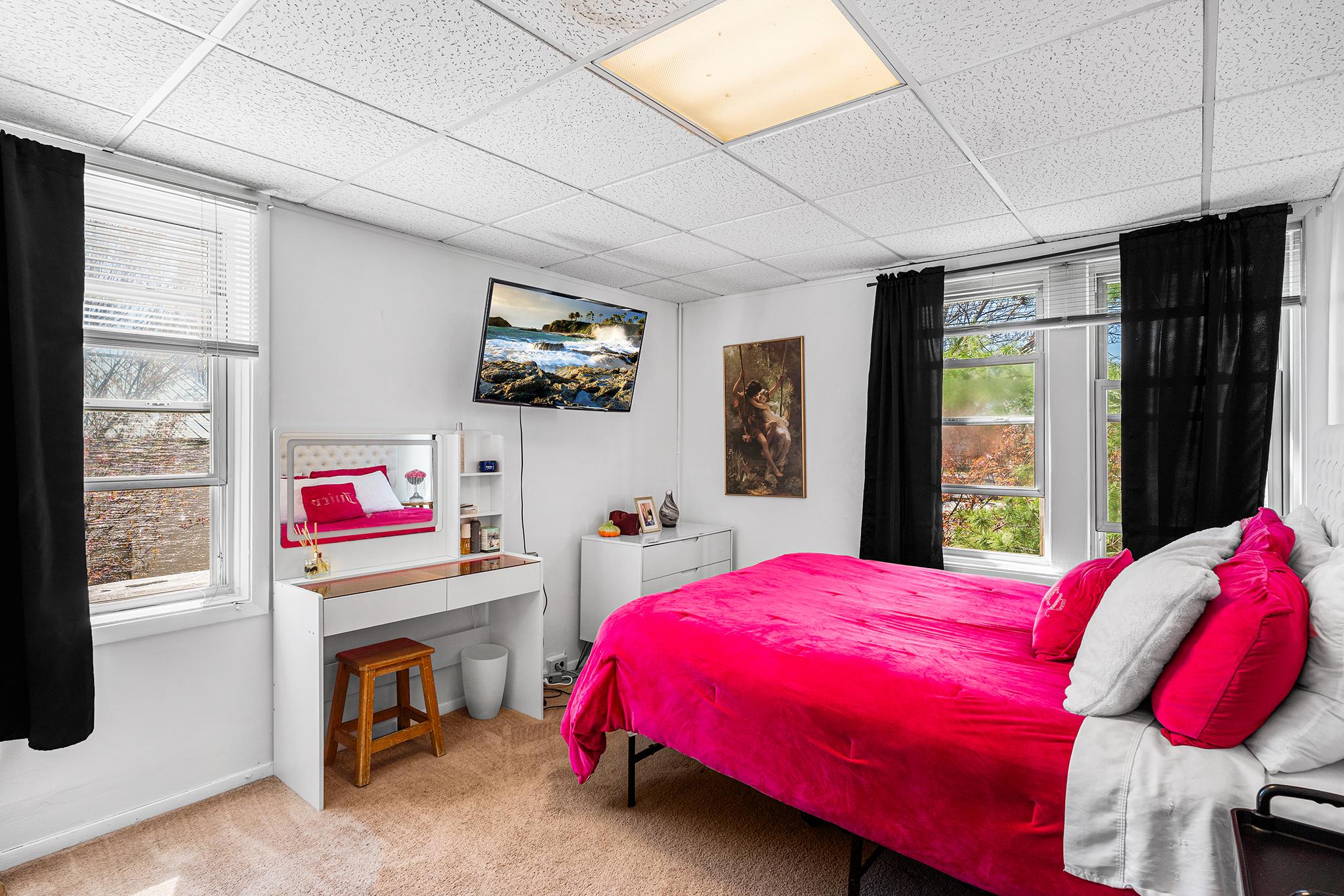 16 Volusia Avenue Hamilton, NJ 08610 - Photo 13 of 50 a bedroom with a bed and a flat screen tv