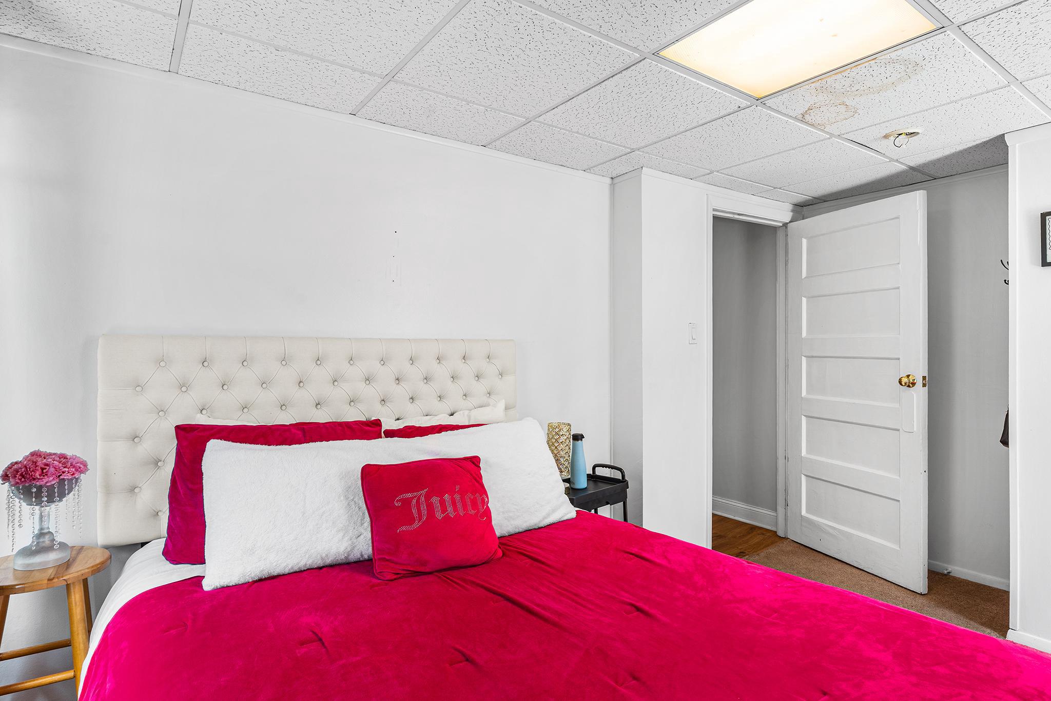 16 Volusia Avenue Hamilton, NJ 08610 - Photo 14 of 50 a bedroom with a bed and a potted plant