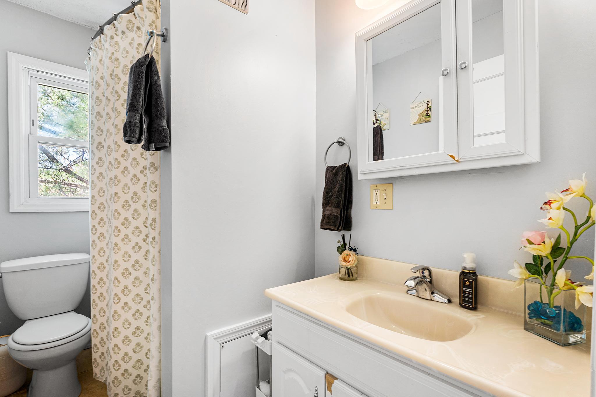 16 Volusia Avenue Hamilton, NJ 08610 - Photo 15 of 50 a bathroom with a toilet sink and mirror