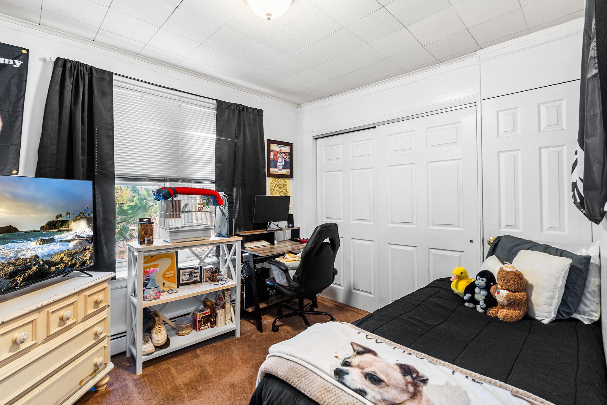 16 Volusia Avenue Hamilton, NJ 08610 - Photo 16 of 50 a room with furniture and a flat screen tv