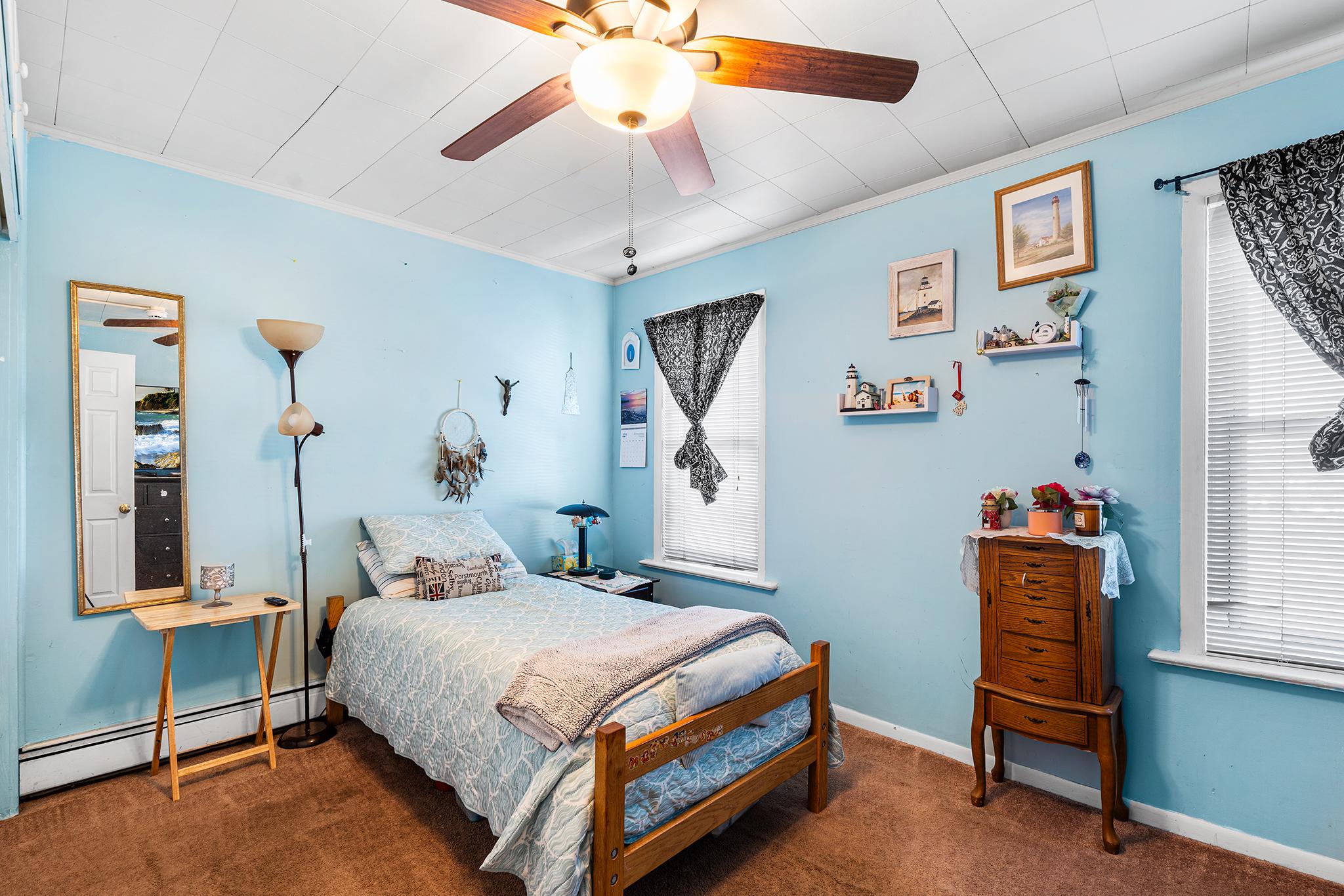 16 Volusia Avenue Hamilton, NJ 08610 - Photo 18 of 50 a bedroom with a bed and a chandelier