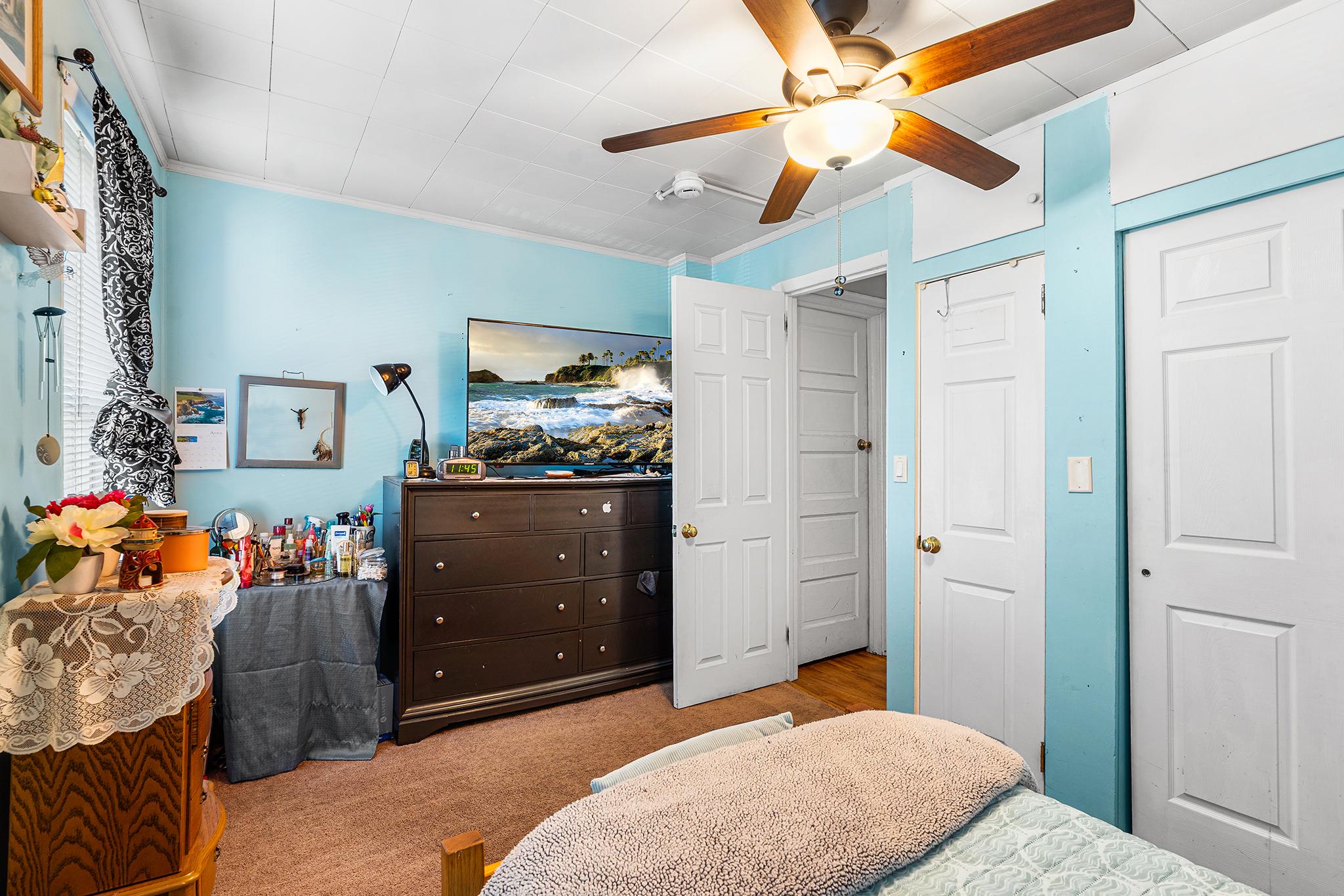 16 Volusia Avenue Hamilton, NJ 08610 - Photo 19 of 50 a bedroom with a bed and a chandelier fan