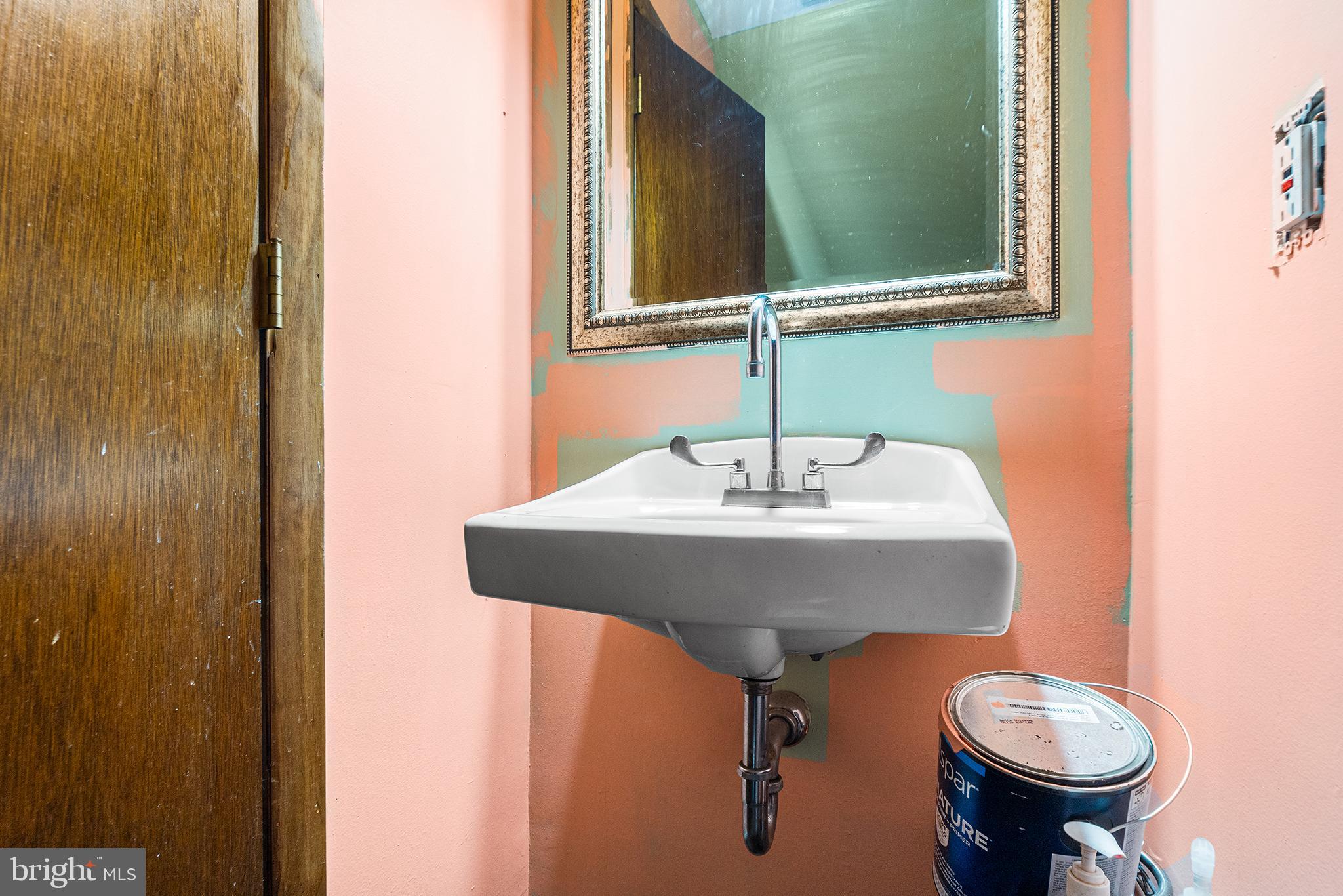 16 Volusia Avenue Hamilton, NJ 08610 - Photo 33 of 50 a bathroom with a toilet sink and mirror