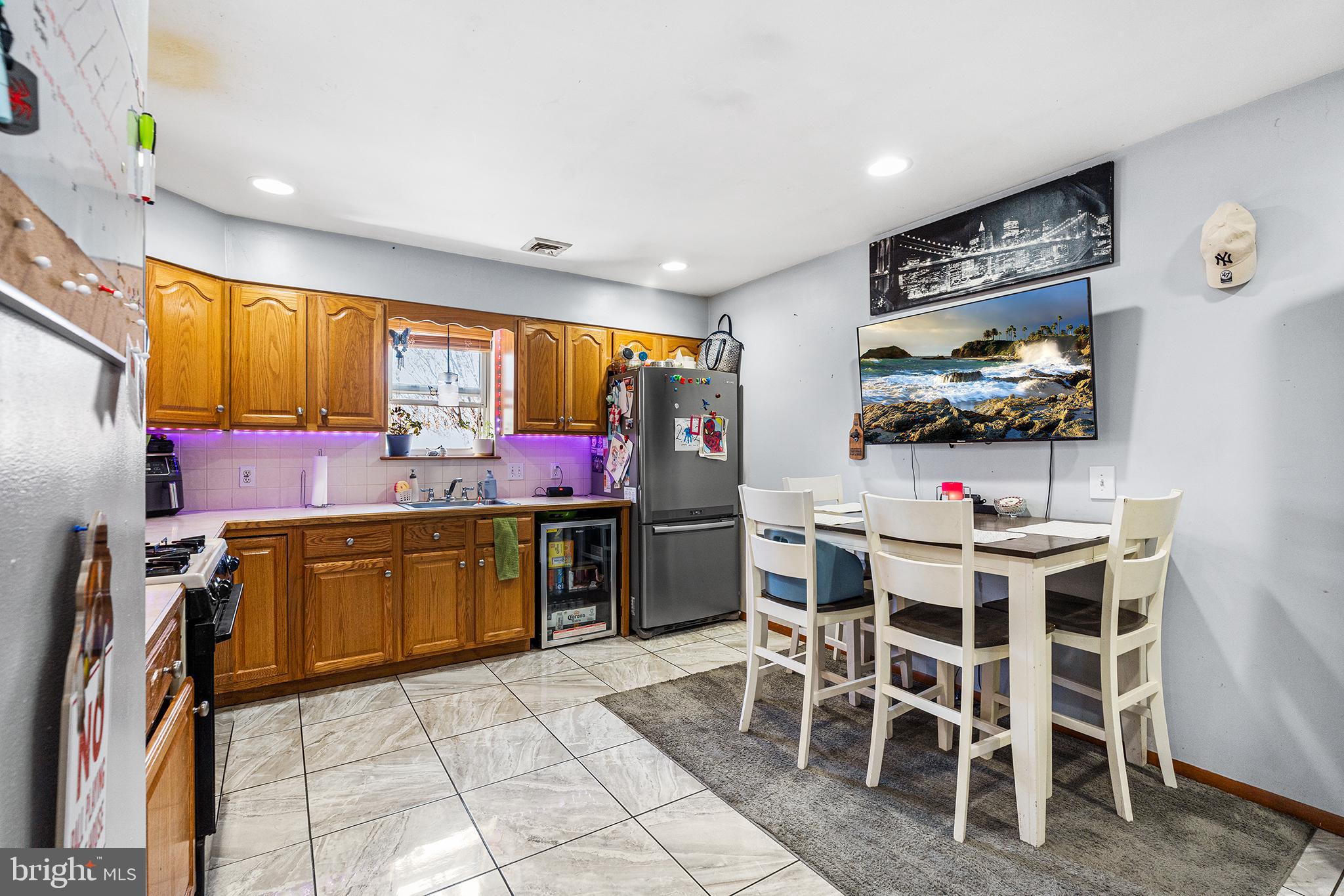 16 Volusia Avenue Hamilton, NJ 08610 - Photo 35 of 50 a kitchen with a sink dining table and chairs