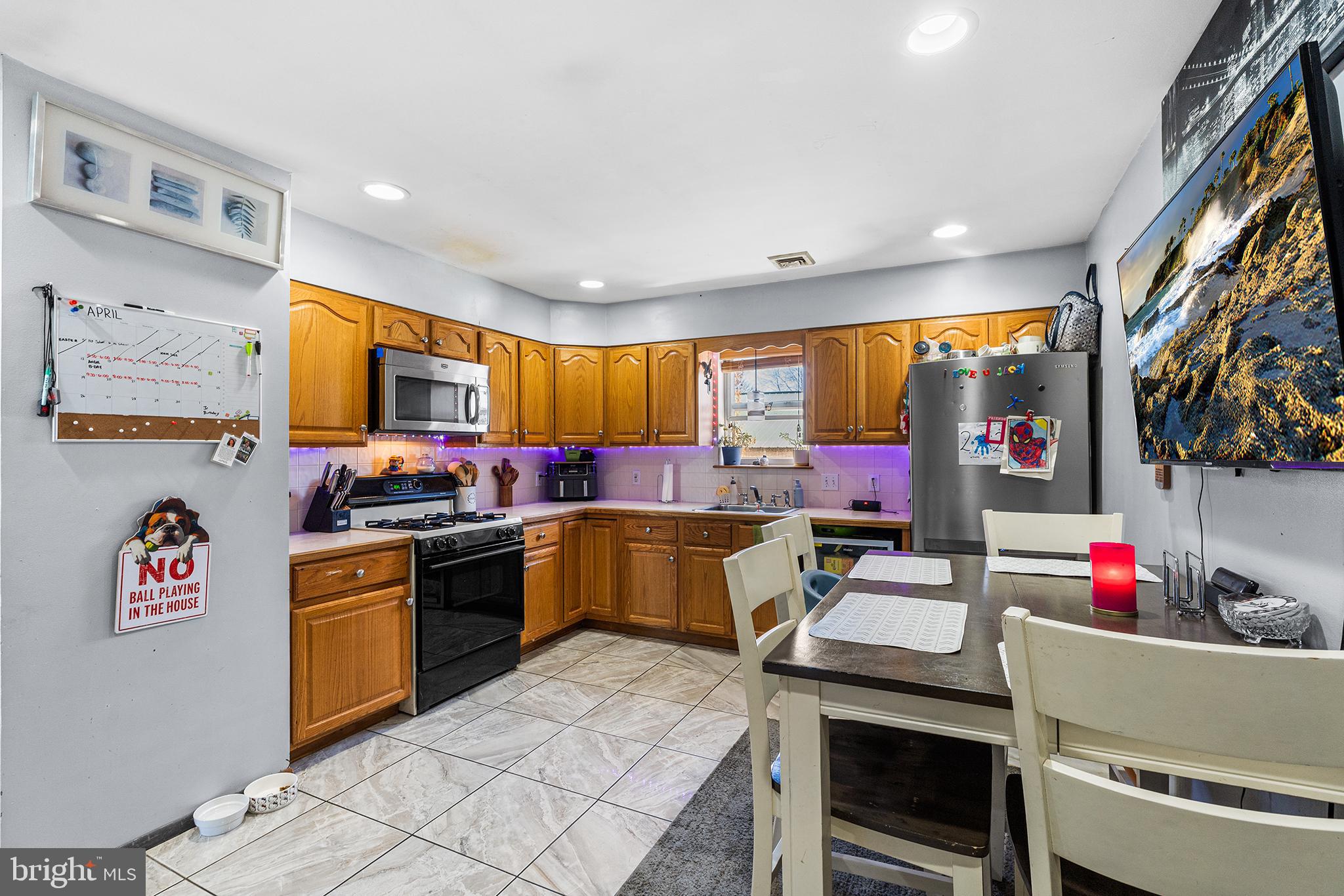 16 Volusia Avenue Hamilton, NJ 08610 - Photo 36 of 50 a kitchen that has a lot of cabinets in it and wooden floors