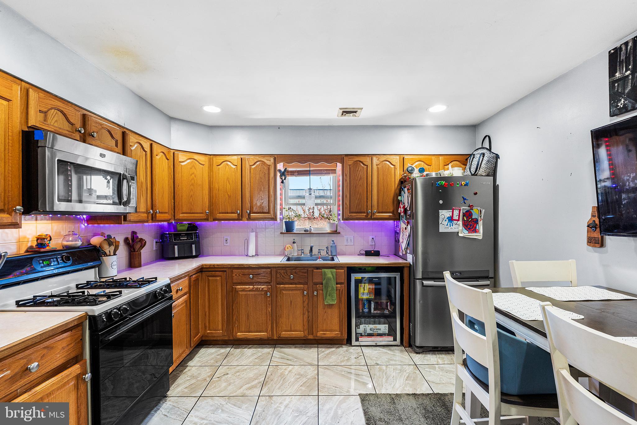 16 Volusia Avenue Hamilton, NJ 08610 - Photo 37 of 50 a kitchen with stainless steel appliances a stove and a sink