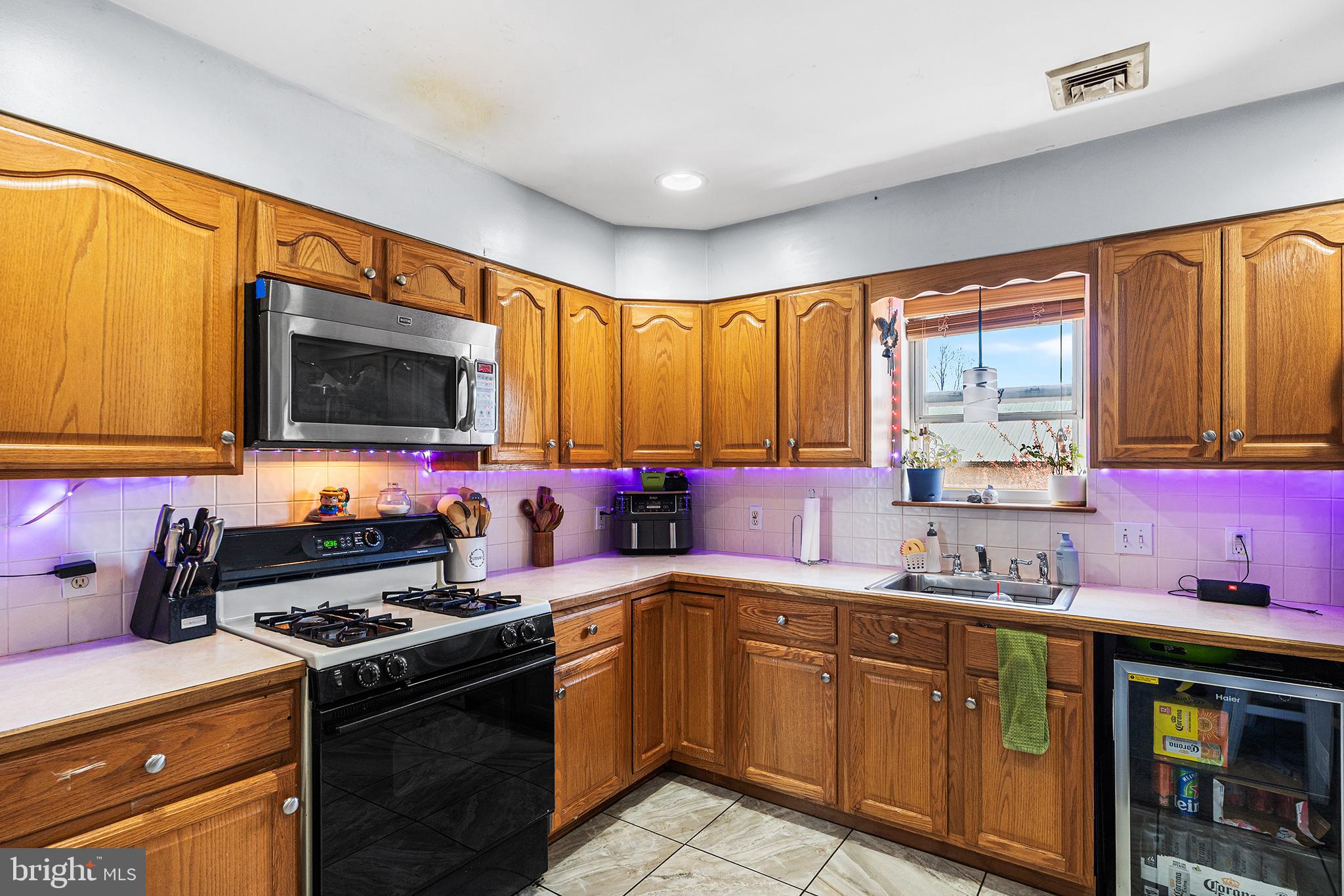 16 Volusia Avenue Hamilton, NJ 08610 - Photo 38 of 50 a kitchen with a sink stove top oven and cabinets