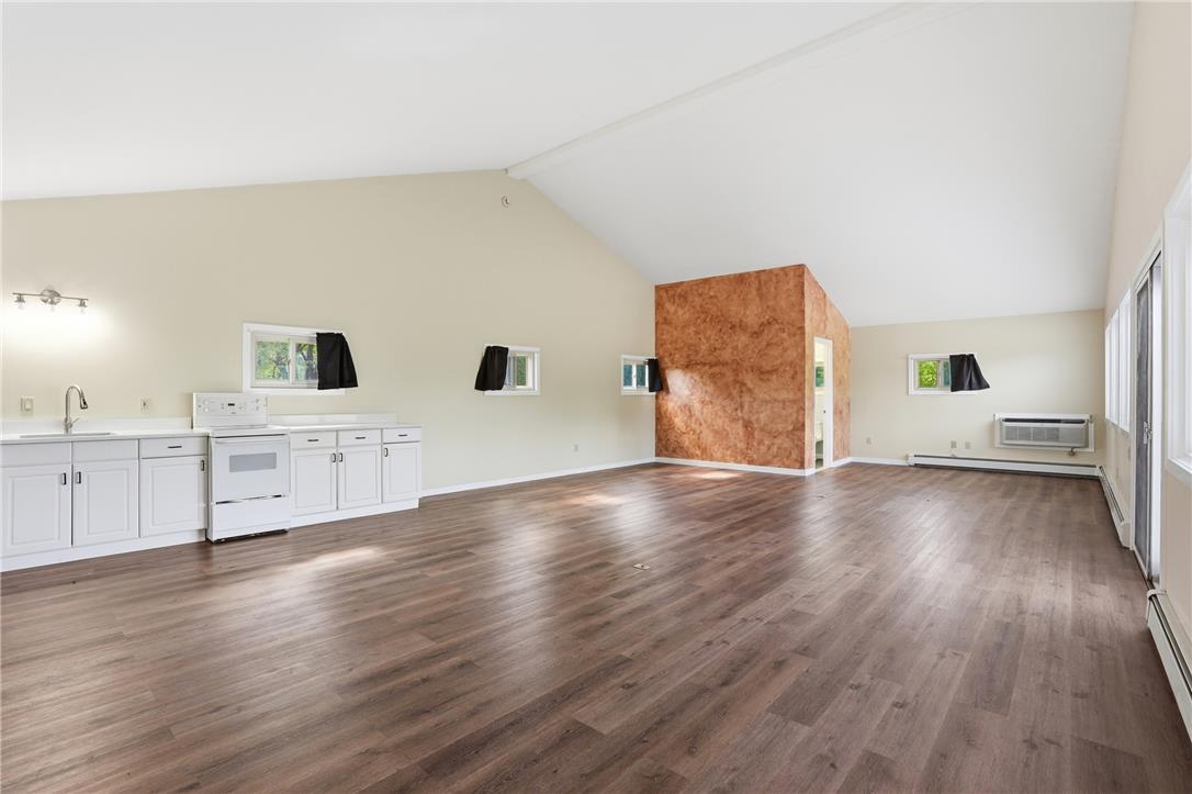6271 Batman Road Zionsville, PA 18092 - Photo 76 of 100 The soaring vaulted ceilings and rich wood flooring create an open and airy living space.