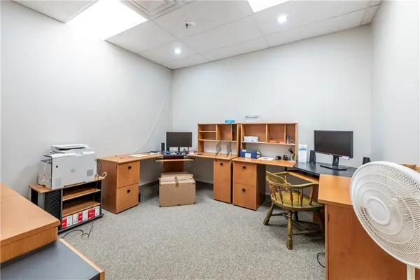 a room with furniture and a flat screen tv