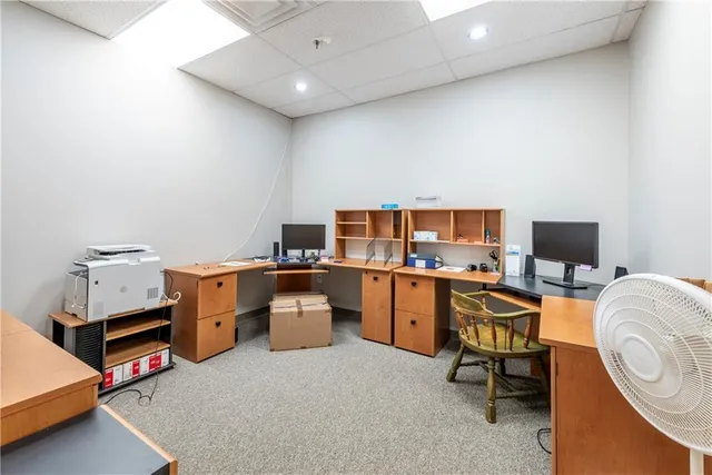 a room with furniture and a flat screen tv