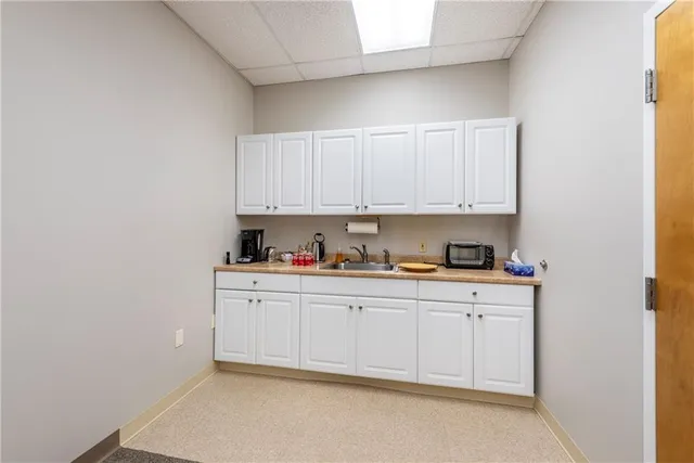 a view of a kitchen with electric appliances