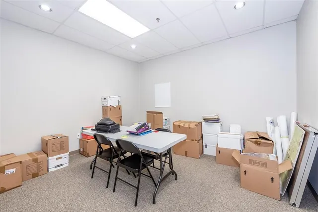 a view of a dining room with furniture and a table