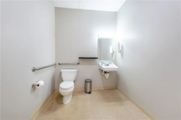 a bathroom with a toilet and a sink