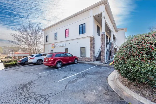 a view of a cars park in front of house