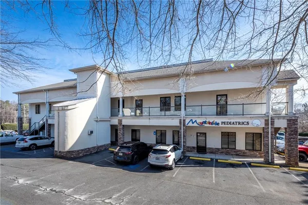 a view of a patio with table and chairs
