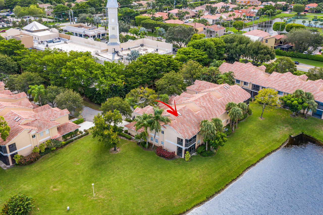 23122 Island View, Unit 6 Boca Raton, FL 33433 - Photo 34 of 38 an aerial view of a house with a garden and swimming pool
