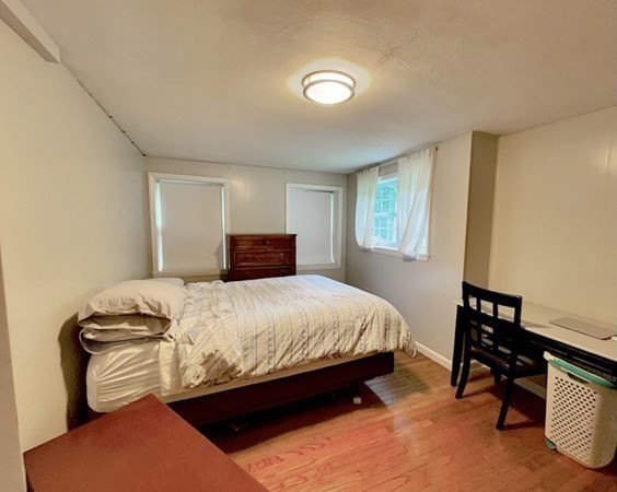 24 Wilbraham Road Hampden, MA 01036 - Photo 14 of 42 a bedroom with a bed and a chair