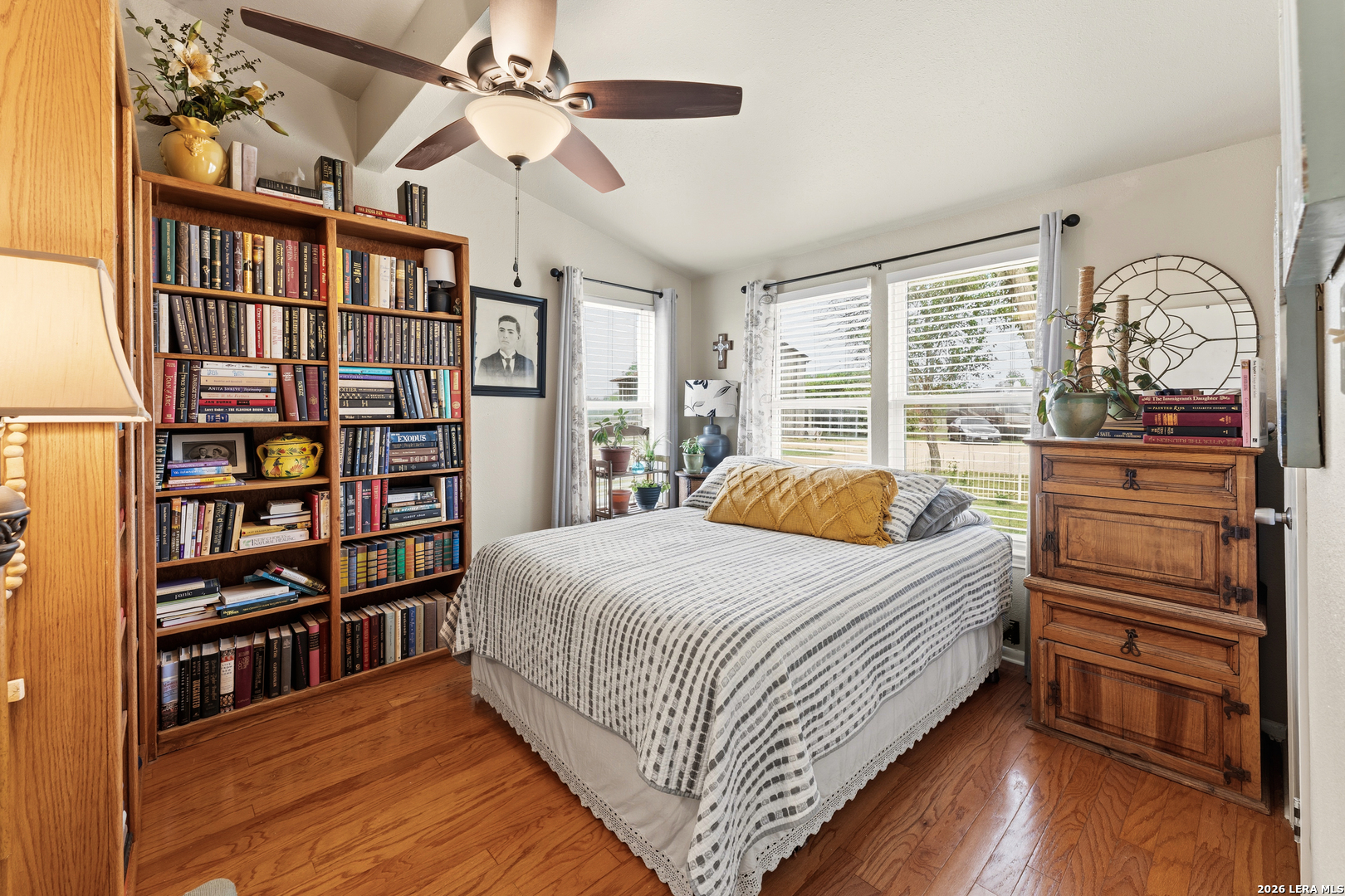 4515 Stapper Road St. Hedwig, TX 78152 - Photo 23 of 64 a bedroom with a bed furniture and a book shelf