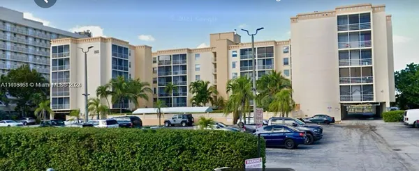 a front view of a building with outdoor seating