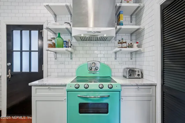 a kitchen with a stove and a microwave