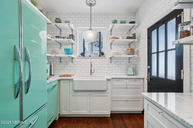 a bathroom with a sink and mirror