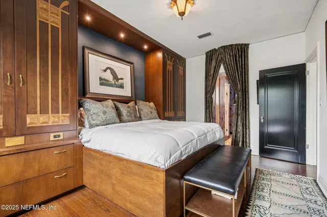 a bedroom with a bed and a dresser