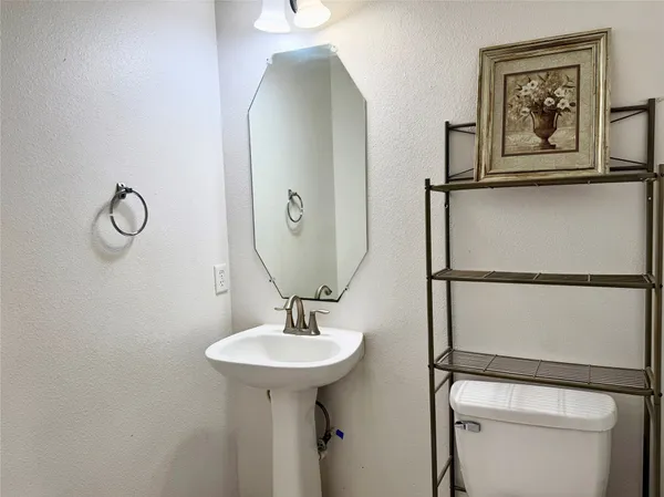 a bathroom with a sink and mirror