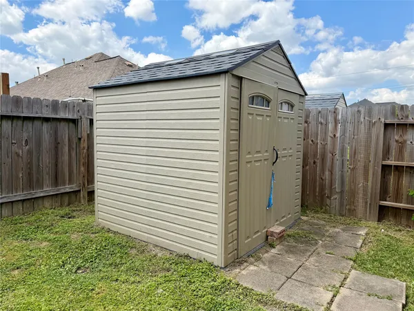 a yellow house with a outdoor space