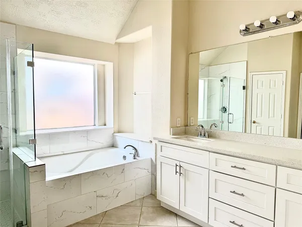 a bathroom with a granite countertop sink mirror and