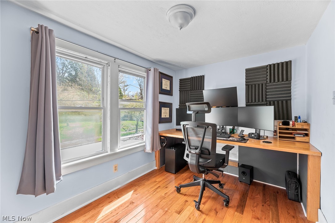 382 Baldwin Road Akron, OH 44312 - Photo 21 of 35 Office area featuring light hardwood / wood-style flooring, built in desk, and a wealth of natural light
