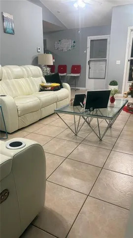 a bedroom with furniture and a mirror