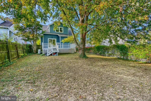 a view of a house with a tree in the yard