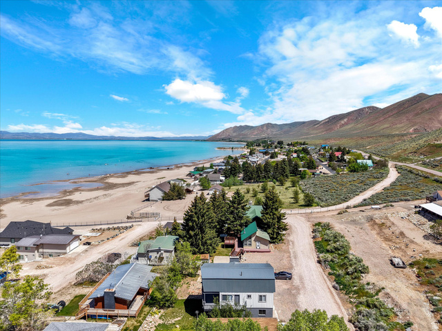 85 B Street, Unit 22 St. Charles, ID 83272 - Photo 12 of 35 Aerial perspective showcasing a vibrant blue body of water and a sandy shoreline