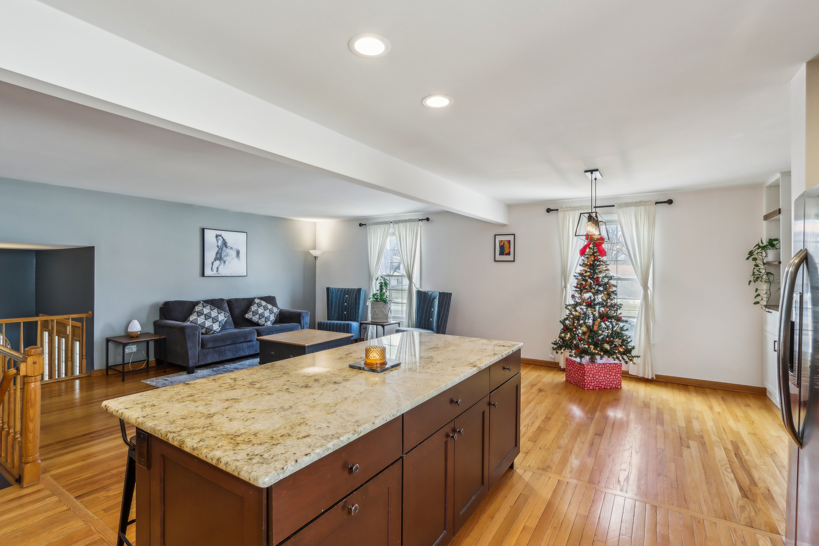 1925 Briarcliffe Boulevard Wheaton, IL 60189 - Photo 13 of 46 a living room with kitchen island furniture and wooden floor