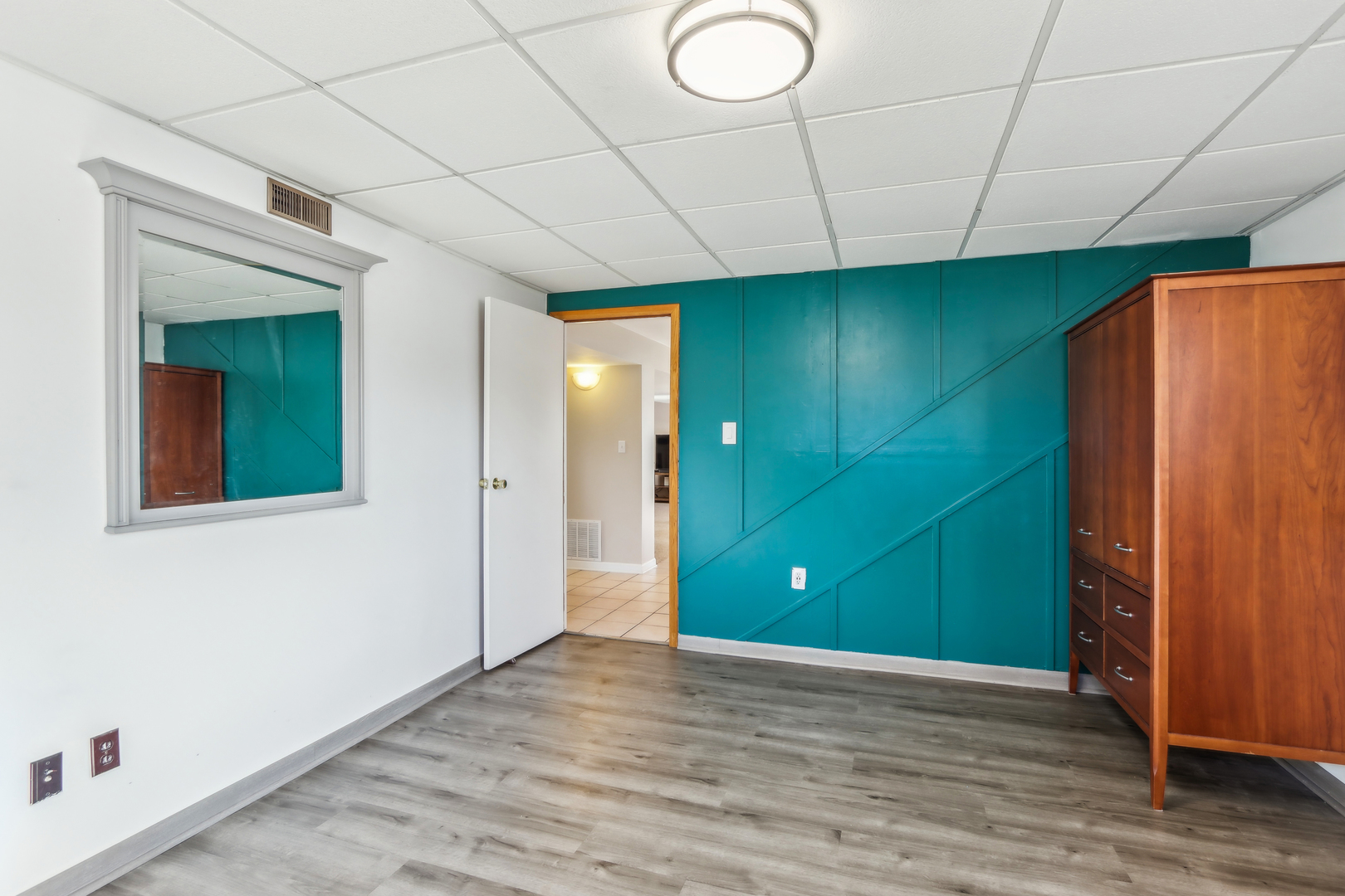 1925 Briarcliffe Boulevard Wheaton, IL 60189 - Photo 26 of 46 a view of empty room with wooden floor and entryway