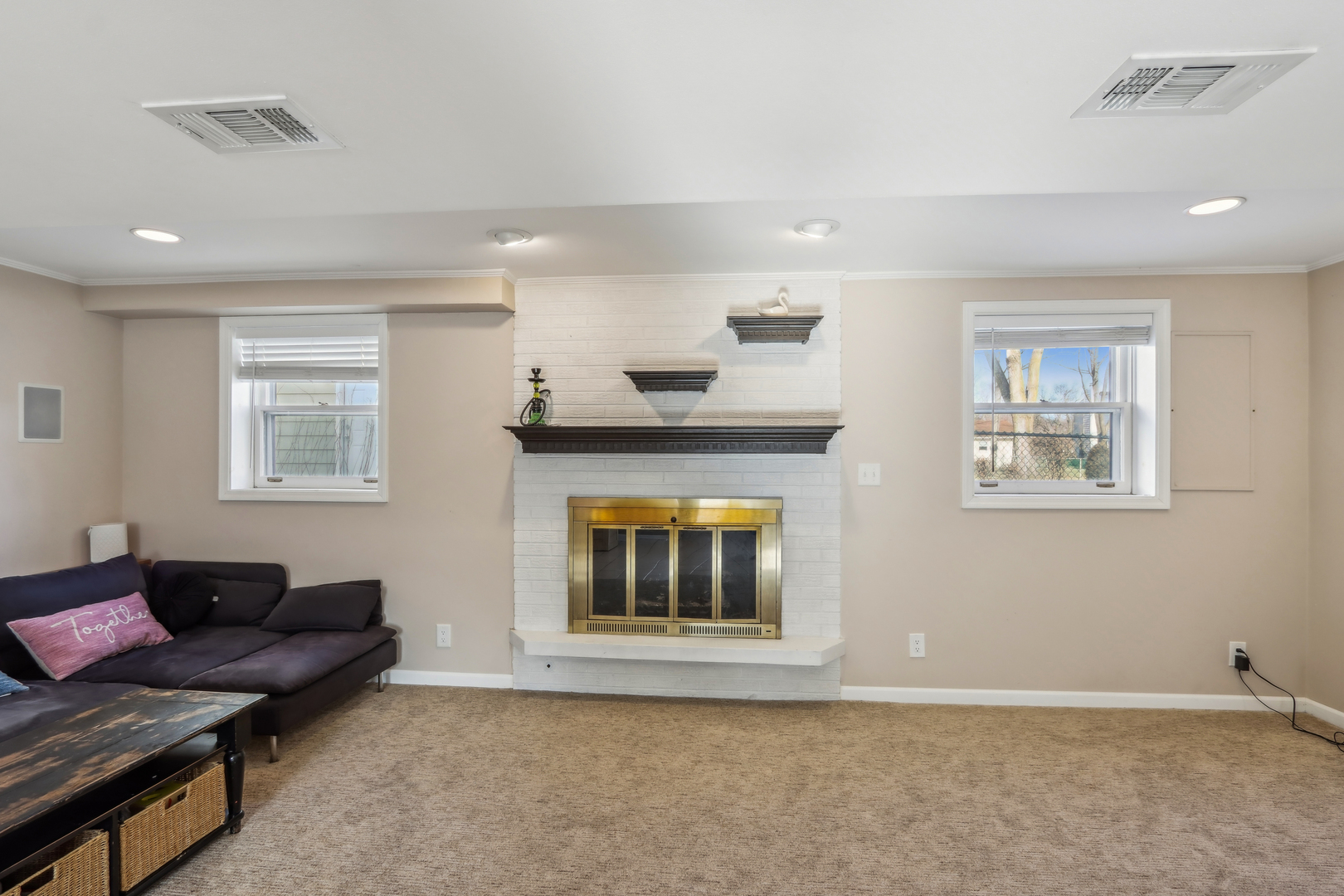 1925 Briarcliffe Boulevard Wheaton, IL 60189 - Photo 34 of 46 a living room with furniture and a fireplace
