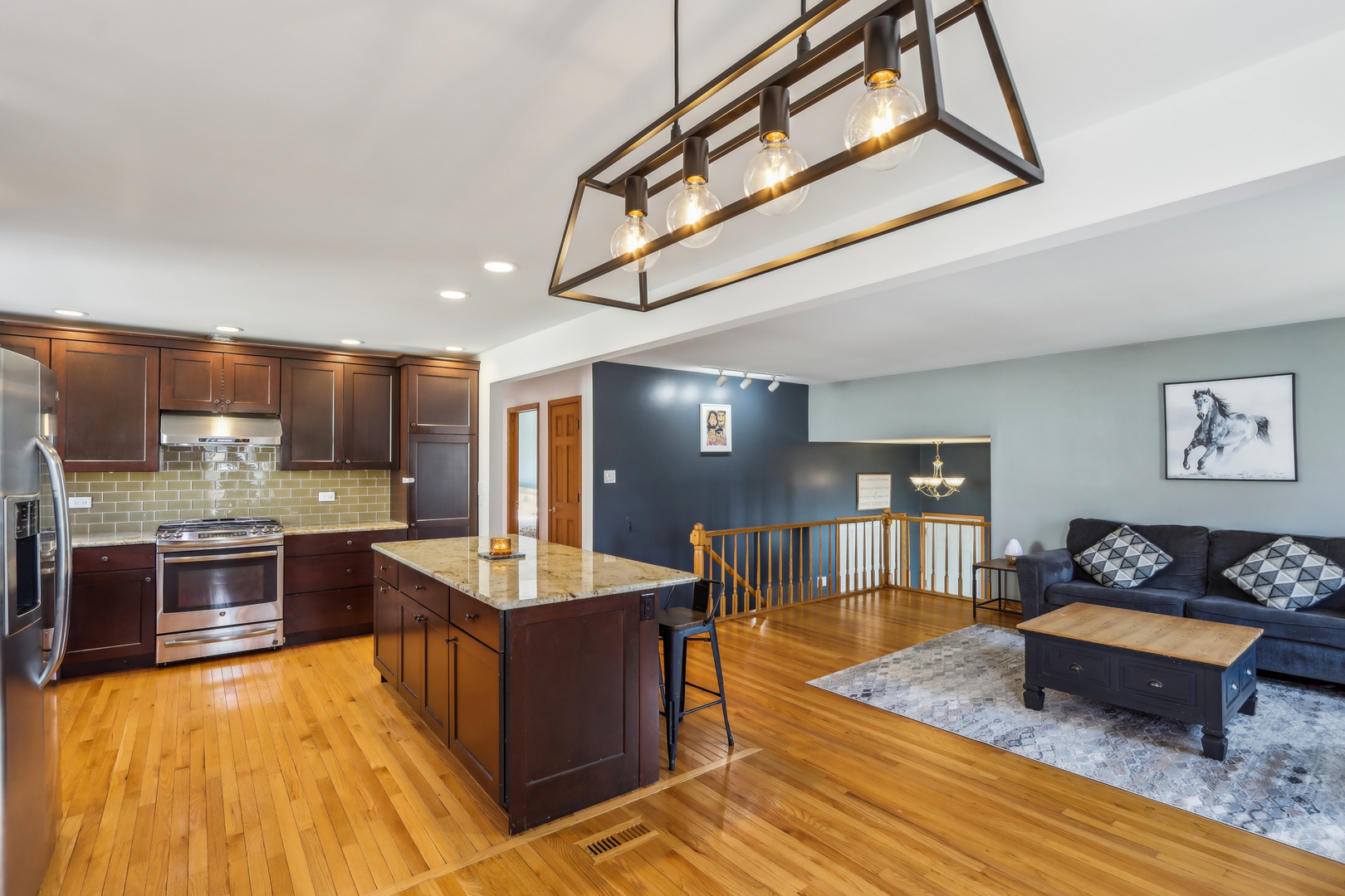 1925 Briarcliffe Boulevard Wheaton, IL 60189 - Photo 9 of 46 a living room with stainless steel appliances kitchen island granite countertop furniture wooden floor and a kitchen view