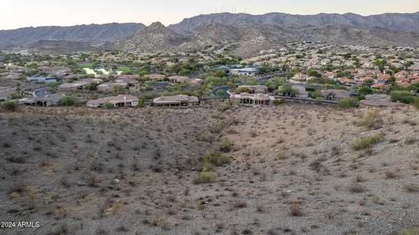 an aerial view of residential house and sandy dunes