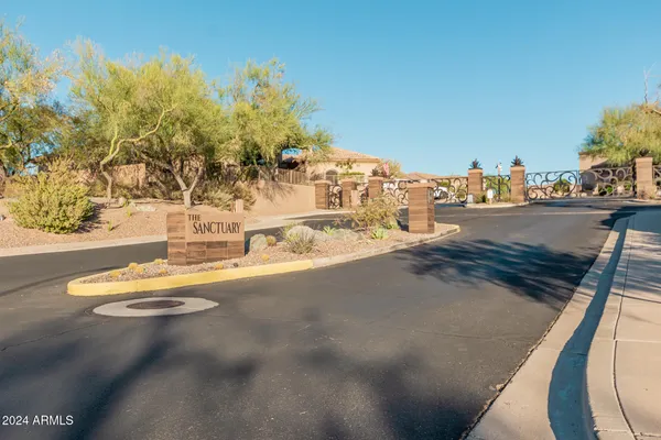 a view of a city street and trees