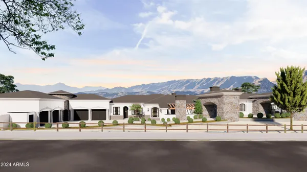 a view of a white house with a table and chairs